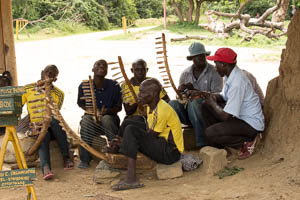 men singing and playing instruments BY JACKSON